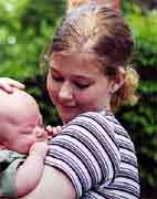 A family photo of Alese Reichart holding her half-brother, Hawk.